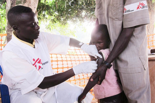 Child being vaccinated against measles, Faradje